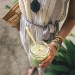 person holding glass cup