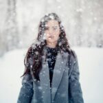 selective focus photograph of woman in gray coat