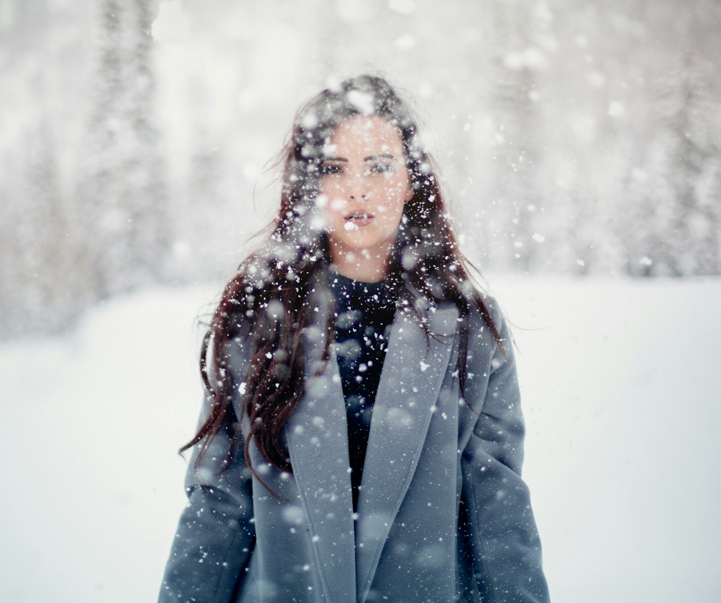 selective focus photograph of woman in gray coat