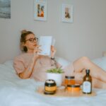 unknown person reading book indoors